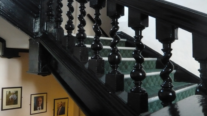 The seventeenth-century staircase of the main building of St Cuthbert's Society. 